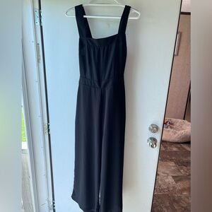 Black pants jumpsuit size large, open back w/bow tie.